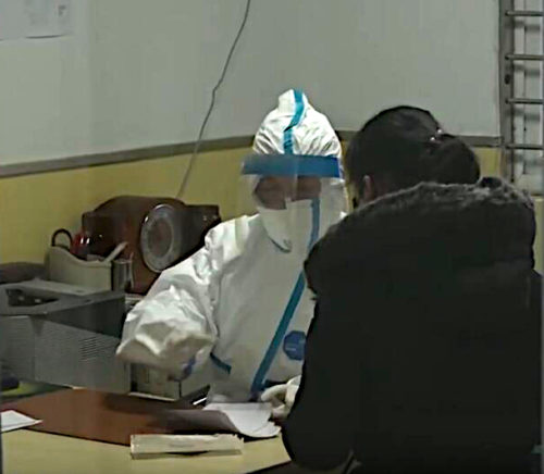 A doctor wearing special protective suit for the Wuhan coronavirus outbreak treat patient in Hubei TCM Hospital, Wuhan