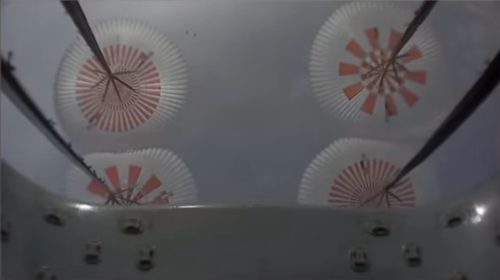 Parachutes deploy on SpaceX's Crew Dragon capsule during the In-Flight Abort Test