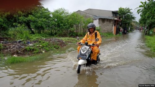 The picture shows flooding in a village outside of Jakarta on January 1, 2020.