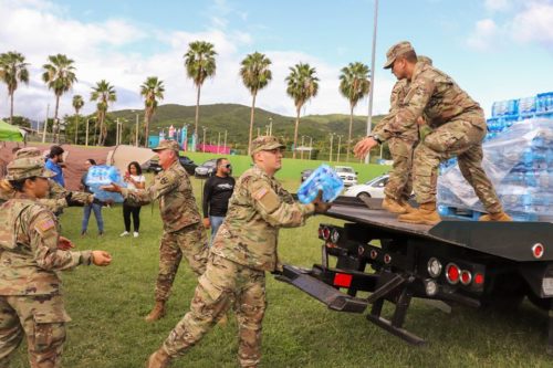 Puerto Rico's National Guard helps distribute bottled water after earthquakes in January, 2020.