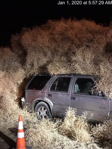 The Washington State Department of Transportation posted this picture of a car covered by tumbleweed.