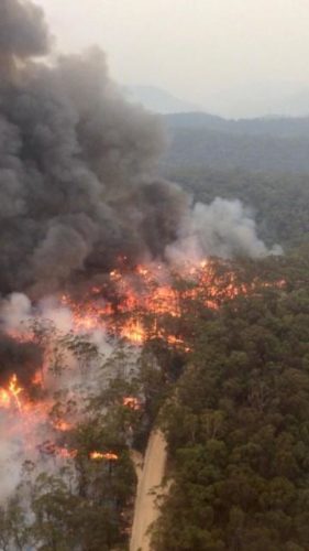 Fires continue to burn throughout Australia. This bird's-eye view was taken by aviation officer Sean Cox in early December.