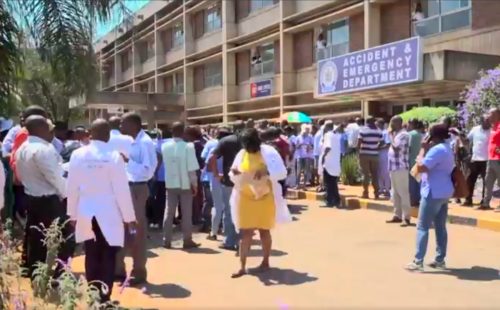 Doctors gather outside a hospital during a four-month strike by Zimbabwe's doctors.