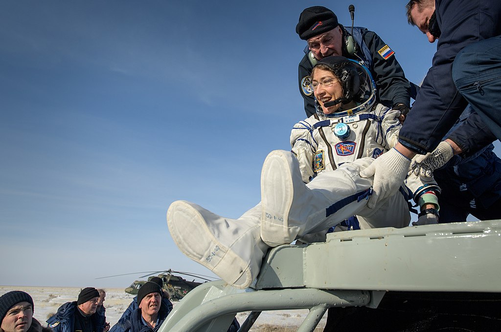 NASA astronaut Christina Koch is helped out of the Soyuz MS-13 spacecraft just minutes after she, Roscosmos cosmonaut Alexander Skvortsov, and ESA astronaut Luca Parmitano, landed in a remote area near the town of Zhezkazgan, Kazakhstan on Thursday, Feb. 6, 2020.