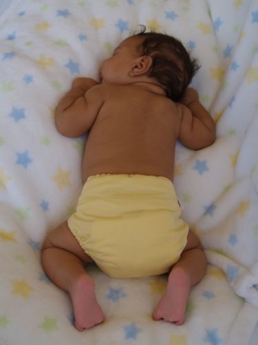 Sleeping baby in a diaper