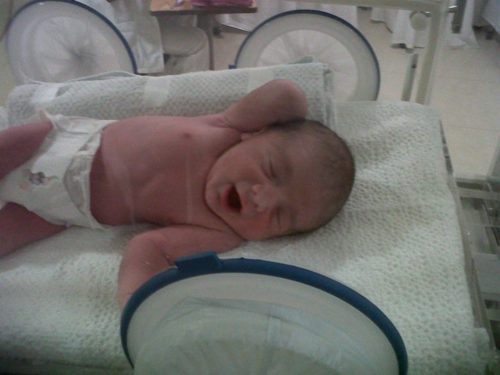 Newborn infant in a diaper
