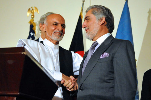 Afghan presidential candidate Ashraf Ghani shakes hands with rival candidate Abdullah Abdullah after both addressed reporters at the United Nations Mission Headquarters in Kabul, Afghanistan on July 12, 2014,