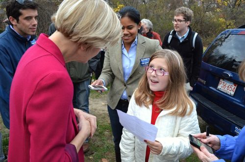 Elizabeth Warren talks with a young girl at a rally in Concord, Massachusetts 10/31/12