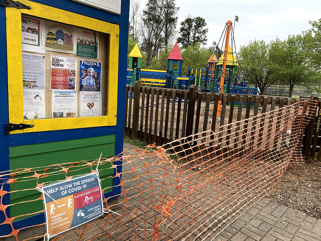 Wake County, North Carolina closed playgrounds on March 23, 2020 in response to the coronavirus outbreak. Apex, within Wake County, shuttered this playground with orange temporary fencing.