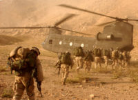 Soldiers return to a helicopter after searching in Daychopan district, Afghanistan, for Taliban fighters and illegal weapons caches.