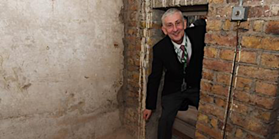 UK Speaker of the House, Lindsay Hoyle, steps through a secret door.