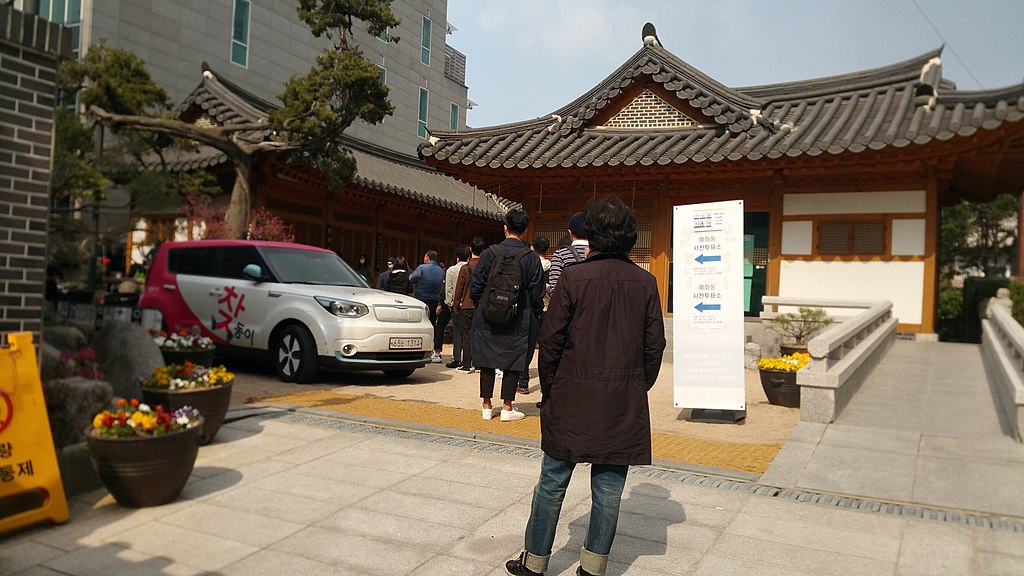 Voters stood 1 meter apart and used disinfectant and disposable gloves during the last day for 2020 South Korean legislative election pre-voting, polling place at Hyehwa-dong, Jongno, Seoul, April 11, during the COVID-19 pandemic.