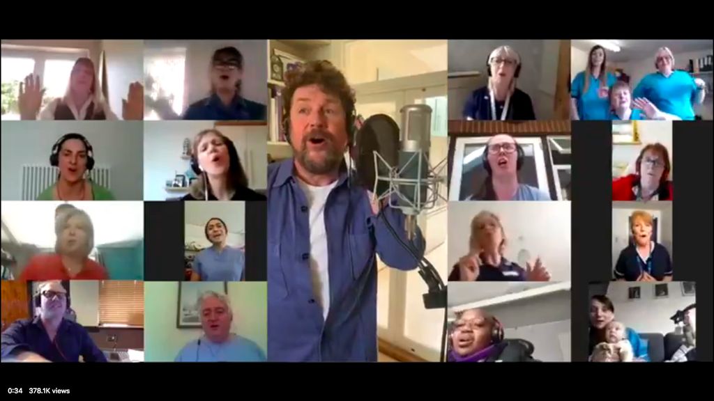 Screenshot from video of Michael Ball and others singing You'll Never Walk Alone.