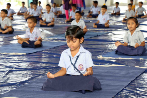 Students of Naval Children School and Naval Kindergarten, Ezhimala participating in the mass yoga demonstration at Indian Naval Academy to commemorate the 3rd International Yoga Day 2017.