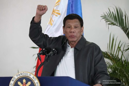 President Rodrigo Roa Duterte raises his fist while delivering his speech upon his arrival at the Francisco Bangoy International Airport in Davao City on October 6, 2019 following a visit to the Russian Federation.