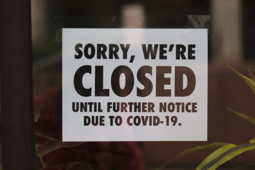 SORRY, WE'RE CLOSED UNTIL FURTHER NOTICE DUE TO COVID-19, sign on business on North Charles Street in Baltimore, Maryland
