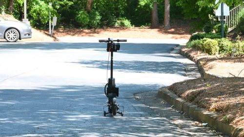 A GoX scooter drives, controlled remotely by someone in Mexico.