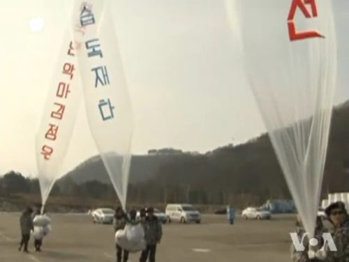 Balloon release by South Korean activists. Activists are likely members of the North Korean People's Liberation Front.