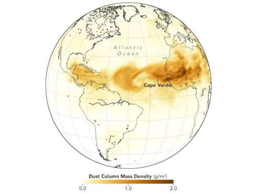 The map shows dust crossing the Atlantic on June 28, 2018, as represented by the Goddard Earth Observing System Model, Version 5 (GEOS-5).