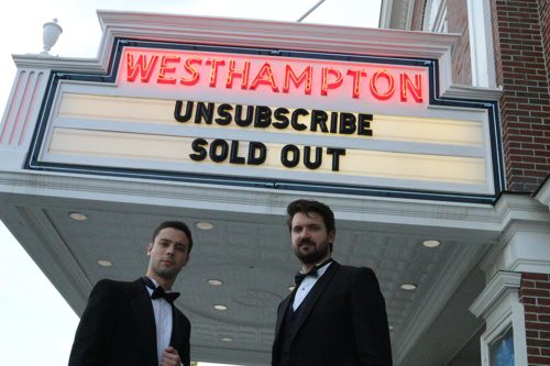 Eric Tabach and Christian Nilsson in front of the movie theater showing their movie, Unsubscribe.