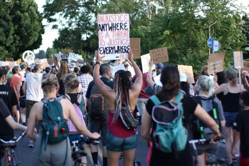 Black Lives Matter demonstration in Portland, Oregon June 23, 2020 Sign: "Injustice anywhere is a threat to justice everywhere."