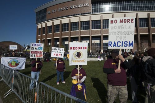 Several thousand protesters marched through Minneapolis to TCF Stadium where the Vikings were playing the Washington DC football team. The protesters called for the Washington team to stop using the name "redskins" for their name and stop using the image of a Native American as their mascot. 2014-11-02