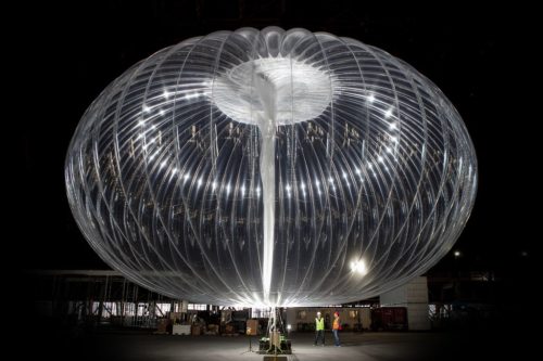 A close-up view of an inflating Loon balloon.