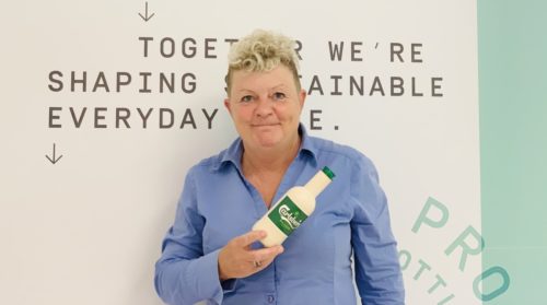 Helle Høst-Madsen, leader of Paboco, holds one of the paper bottles the company is developing with the beer company Carlsberg.