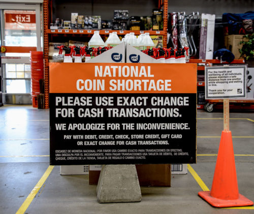 The national coin shortage hits Southern California, blamed on virus-related slowdowns of U.S. mints. This sign is in a Home Depot store in Upland, California.