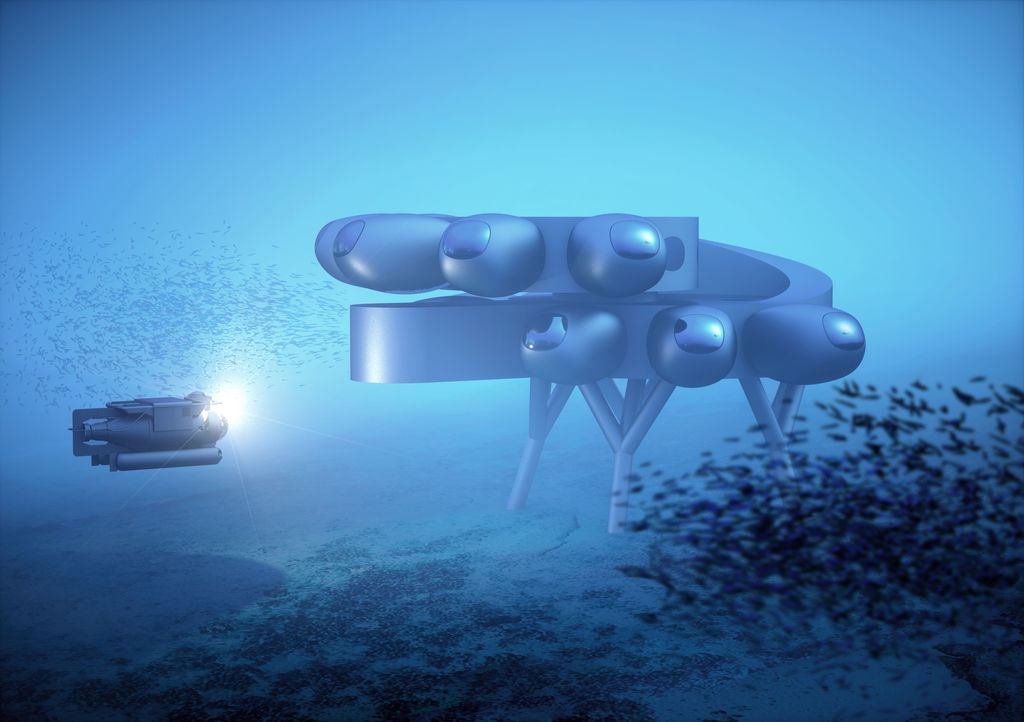 Fabien Cousteau's PROTEUS™. Full view from side with school of fish.