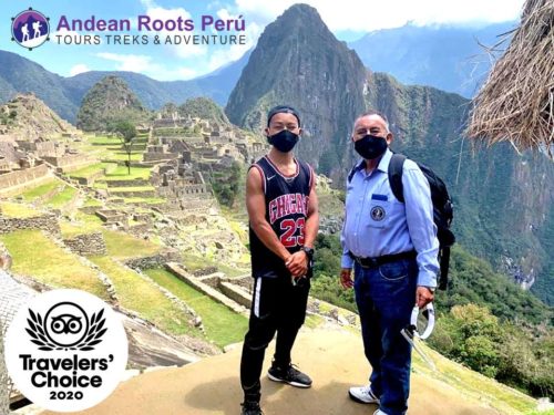 Jesse Katayama at Machu Picchu with a guide.