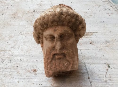 The stone head of Hermes found in a sewer under Athens.