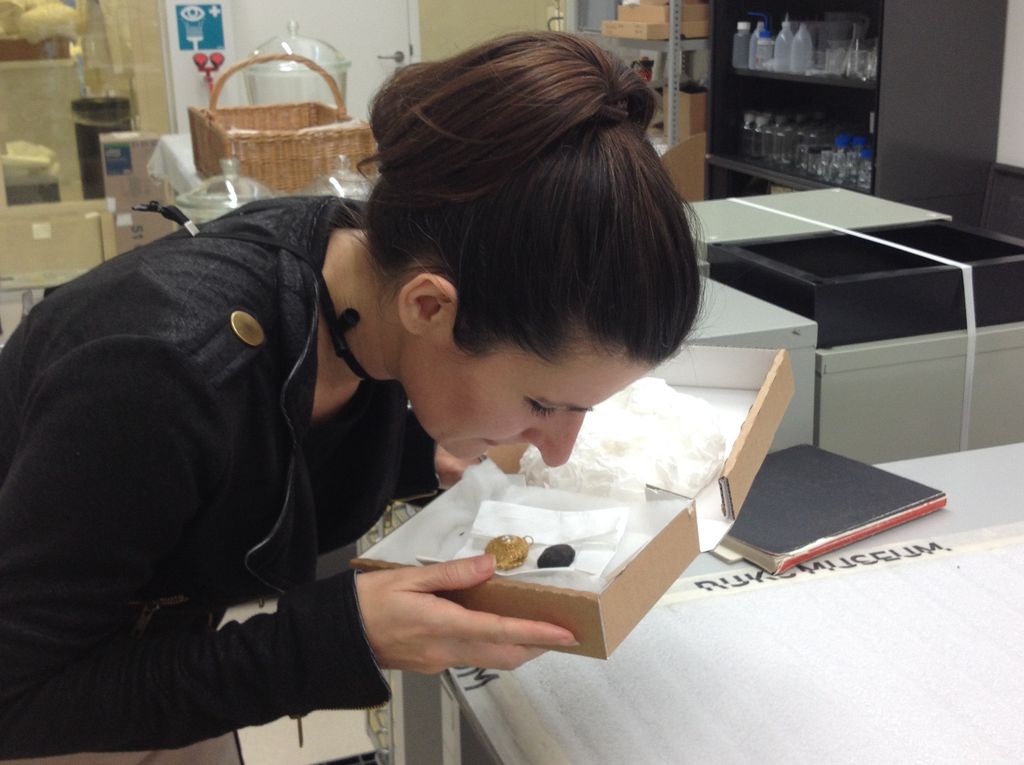 Researcher Caro Verbeek smelling a pomander