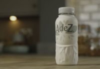 A paper bottle developed by Paboco and Coca-Cola is shown sitting on a counter top. The bottle will be tested this summer in Hungary on the fruit drink brand Adez.