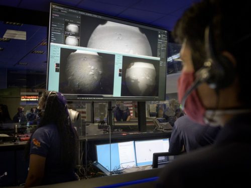 Members of NASA’s Perseverance Mars rover team watch in Mission Control at NASA's Jet Propulsion Laboratory in Southern California as the first images arrive moments after the spacecraft successfully touched down on Mars, on Thursday, Feb. 18, 2021.