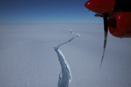 A picture of the crack separating A74 from the Brunt Ice Shelf, taken from an airplane. The plane's propeller can be seen in the upper right of the picture.