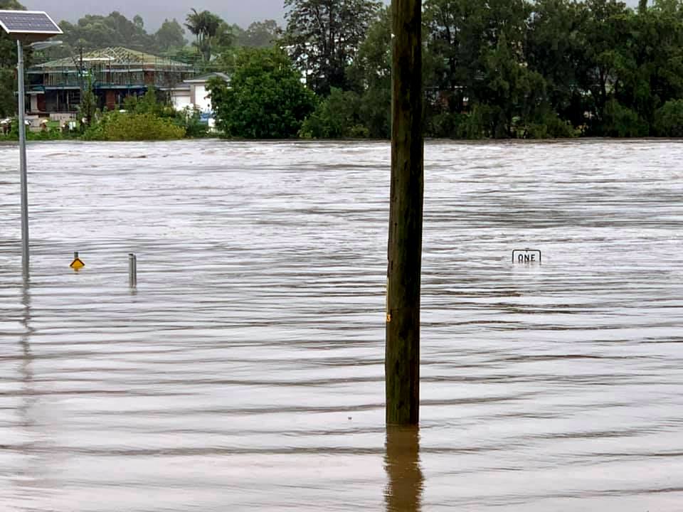 Road signs submerged in Penrith, NSW during the March 2021 floods.