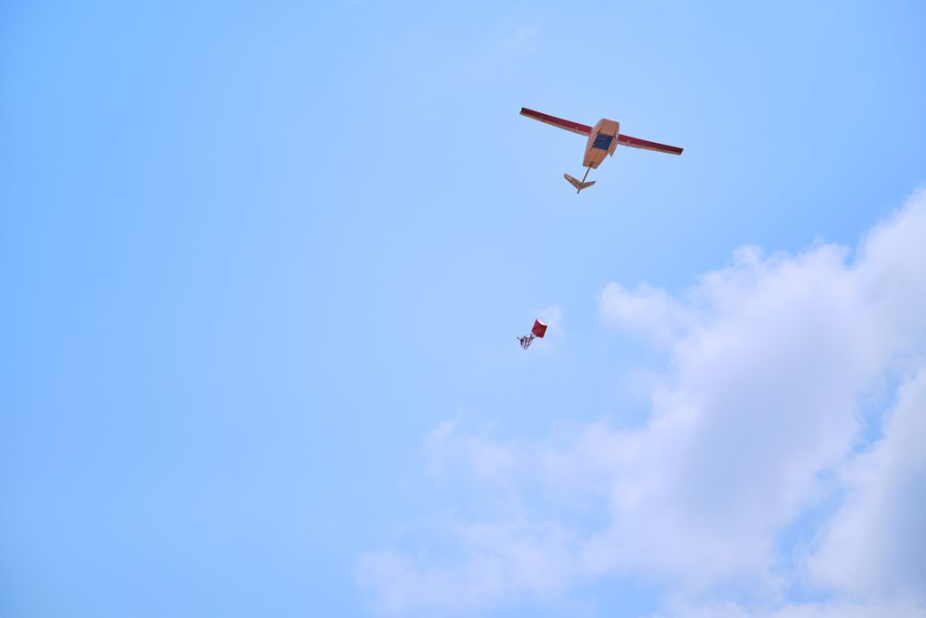 A Zipline drone drops a medical package off.