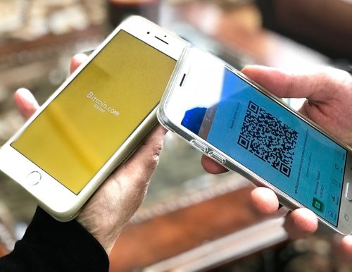 A photo of two mobile phones displaying Bitcoin.com Bitcoin Cash wallets.