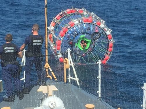 U.S. Coast Guard crews stopped Reza Baluchi (seen sticking his head out of his bubble craft) during his journey from Florida to Bermuda on Sunday.