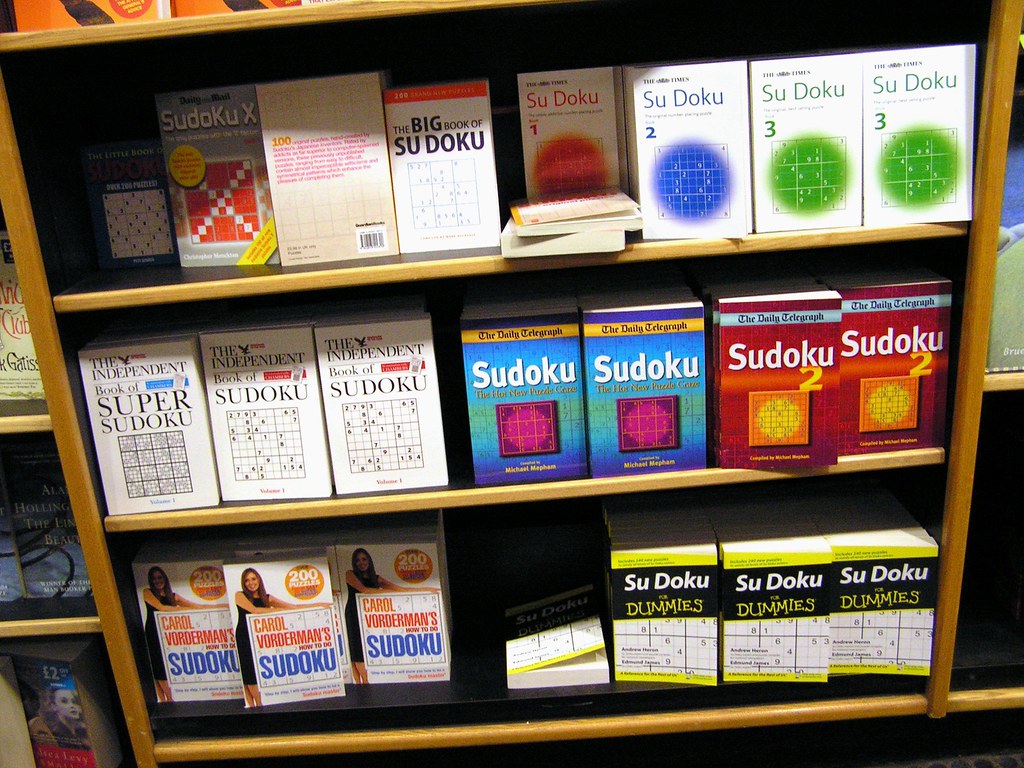 A complete bookshelf of books with Sudoku puzzles or about Sudoku.