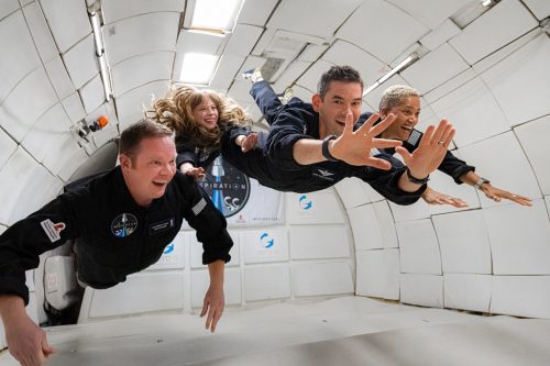 Crew of the Inspiration4 mission floating during weightlessness during ZERO-G flight