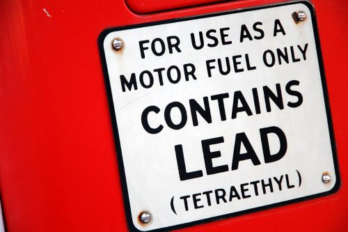 Warning sign saying, "For use as a motor fuel only. CONTAINS LEAD (Tetraethyl)".