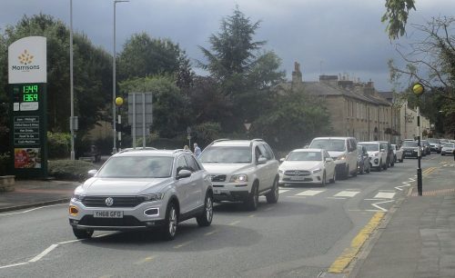 A long queue of cars waiting to purchase fuel during panic buying at Morrisons petrol station, Wetherby as a result of the 2021 United Kingdom fuel crisis 