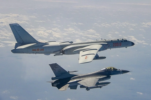 A ROC Airforce F-16 fighter jet shadows a PLA Airforce Bomber that had approached the island of Taiwan.