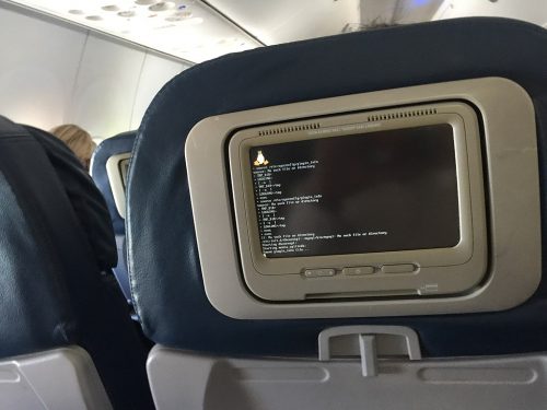 An in-flight entertainment system displaying the Linux boot screen