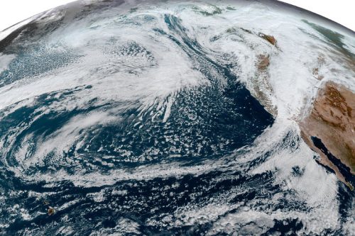 This simulated natural-color image, acquired on October 25 by NOAA’s Geostationary Operational Environmental Satellite 17 (GOES-17) shows an arc of clouds stretching across the Pacific—a visible manifestation of the atmospheric river pouring moisture into the Pacific Northwest.