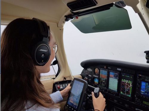 Zara Rutherford at the controls of her plane.