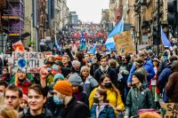 A street packed with protesters during the Global Day of Action for Climate Justice march in Glasgow, Scotland.