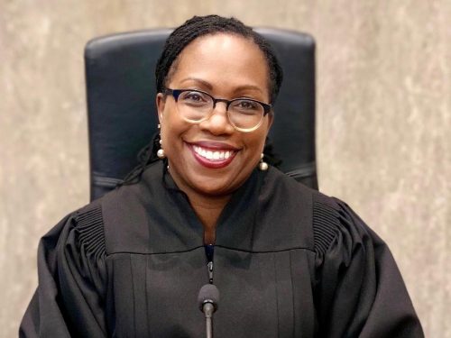 Official portrait of Judge Ketanji Brown Jackson in 2019, seated, wearing her black judge's robe.